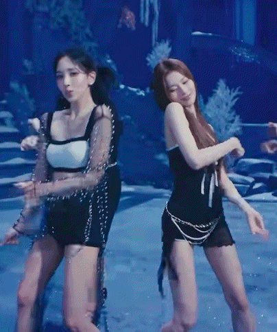 Two Women Dancing in Blue Pool