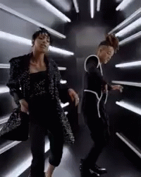 Two Women Dancing In Dark Room GIF