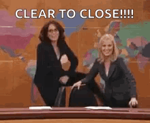 Two Women Dancing In Front Of World Map Saying Clear To Close GIF