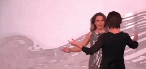 Two Women Dancing On Stage GIF