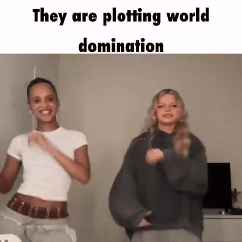Two Women Dancing Plotting World Domination GIF