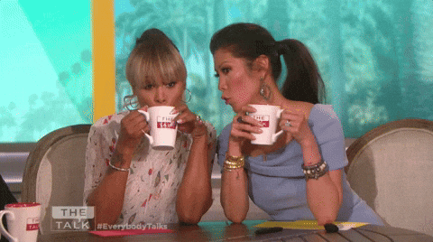 Two Women Drinking From The Talk Mugs