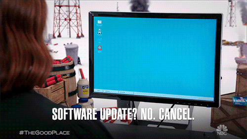 Two Women Facing Monitor Software Update GIF
