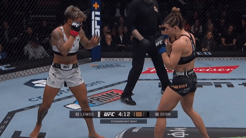 Two Women Fighting In UFC Ring Clock 4:12 GIF