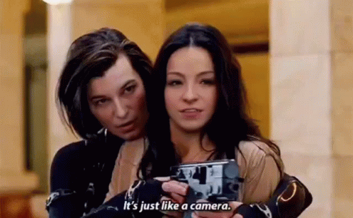 Two Women Holding Camera And Talking GIF