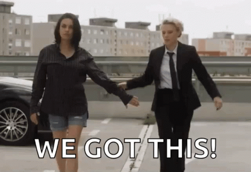Two Women Holding Hands In A Parking Lot With The Words We Got This On The Bottom GIF