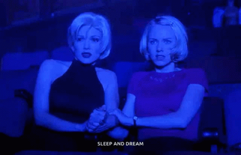 Two Women Holding Hands Watching Movie Sleep and Dream