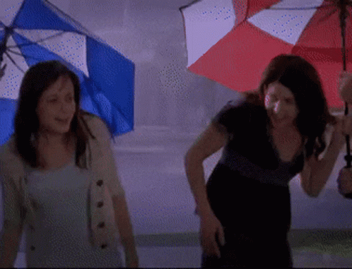Two Women Holding Umbrellas In The Rain GIF