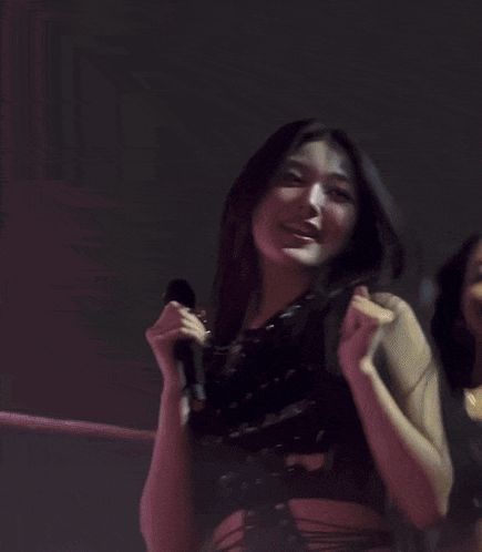Two Women Hugging on Stage