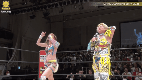 Two Women In A Wrestling Ring With Marigold Rising Spirit 2025 Written On The Bottom GIF