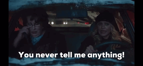 Two Women in Car Saying You Never Tell Me Anything