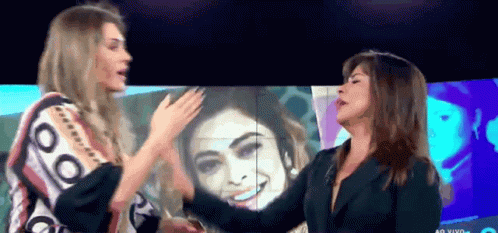 Two Women in Front of Ao Vivo Screen
