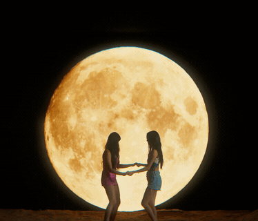 Two Women in Front of Full Moon