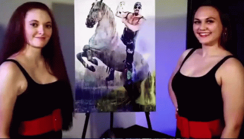 Two Women in Front of Horse Riding Painting