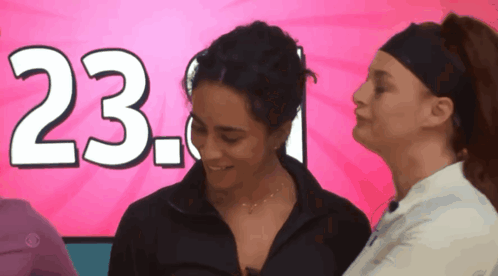 Two Women In Front Of Pink Background With 23.1 GIF