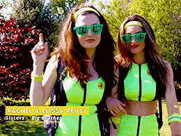 Two Women In Neon Green Outfits And Sunglasses GIF