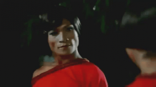 Two Women In Red Shirts Dancing In Front Of Crowd With Man In Black P Shirt GIF