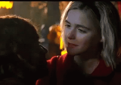 Two Women in Red Sweaters
