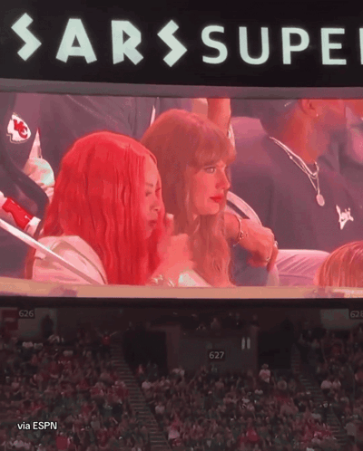 Two Women in Stands with SARS Super Screen