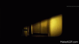 Two Women In White Dresses In Dark Room GIF