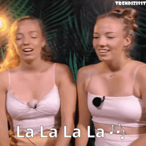 Two Women In White Tank Tops Are Singing La La La La .. GIF
