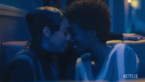 Two Women Kissing Dark Room Netflix Logo