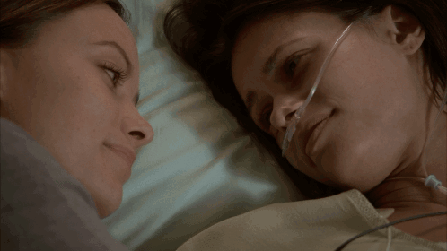 Two Women Kissing in Hospital Bed