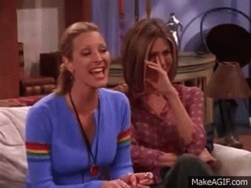 Two Women Laughing, One Covering Mouth