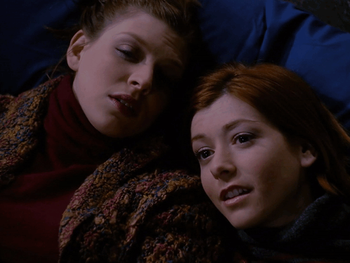 Two Women Laying on Bed Saying Hence the Name
