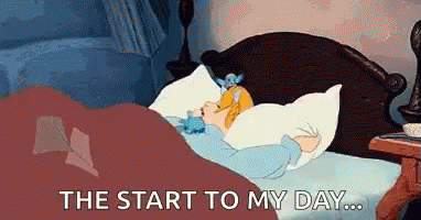 Two Women Laying on Bed With Stuffed Rabbit
