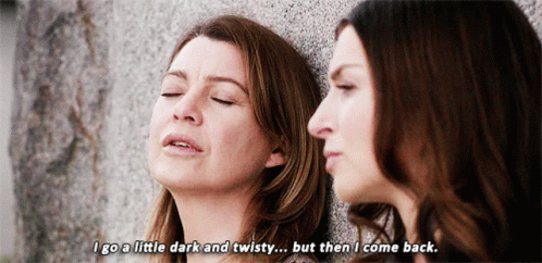 Two Women Leaning Against A Wall With One Saying " I Go A Little Dark And Twisty But Then I Come Back GIF