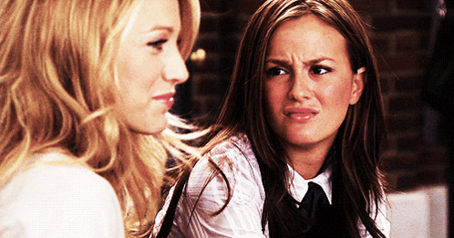 Two Women Looking At Each Other Making Face GIF