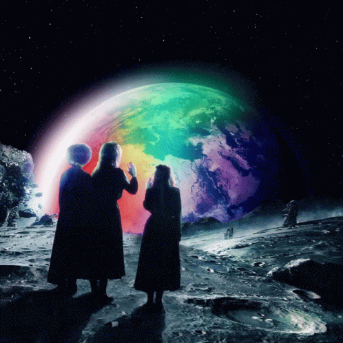 Two Women Looking at Rainbow Colored Planet