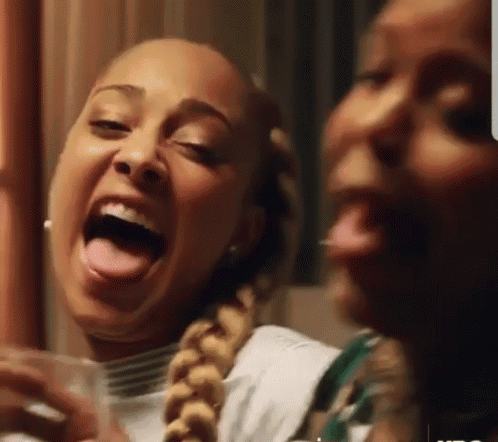 Two Women Making Funny Faces With Tongues Out GIF