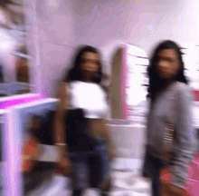 Two Women Next to Each Other in Blurry Room