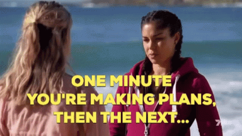 Two Women on Beach Saying One Minute You're Making Plans Then the Next