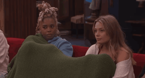Two Women On Couch Saying I Am Sat