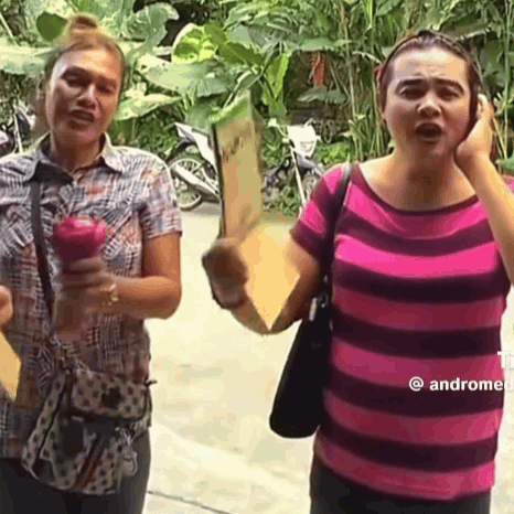 Two Women One Holding Apple One Holding Sign