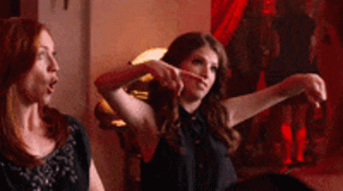 Two Women One Pointing At Camera GIF