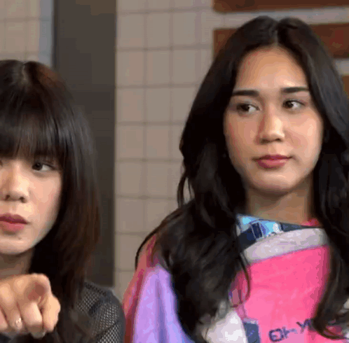 Two Women One Wearing Pink Shirt Saying Enjoy