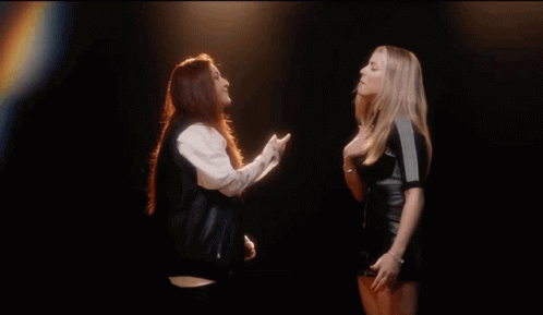 Two Women One Wearing ZZ Shirt GIF
