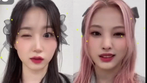 Two Women Pink Hair One Winking