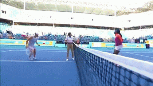 Two Women Playing Tennis