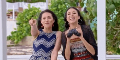 Two Women Pointing GIF