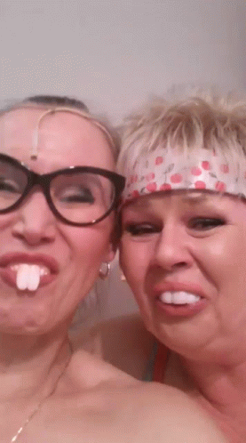Two Women Posing One Wearing Glasses GIF