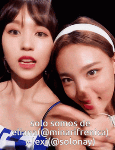 Two Women Posing With Caption Solo Somos De Eliana @Minarifrenica Y Lexi @Solonay GIF