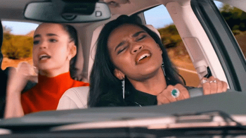 Two Women Singing in Car