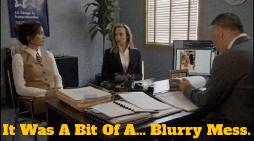 Two Women Sit At A Desk Talking To A Man With The Words It Was A Bit Of A Blurry Mess Above Them GIF