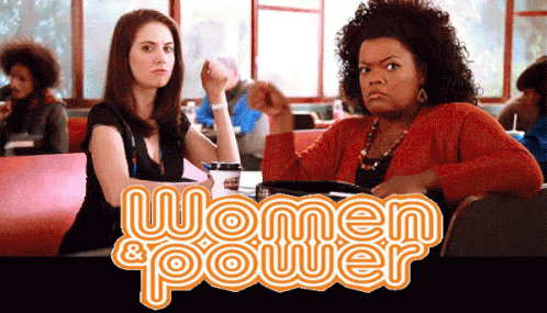 Two Women Sitting at Table Saying Women & Power