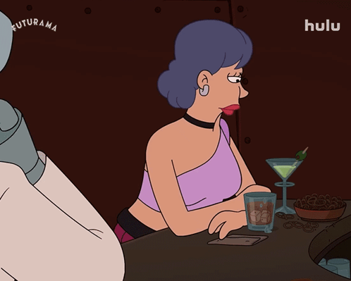 Two Women Sitting at Table With Who Me